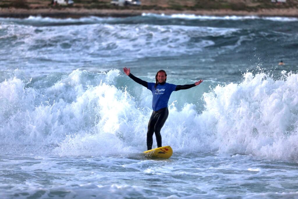 Surfer celebrates wave