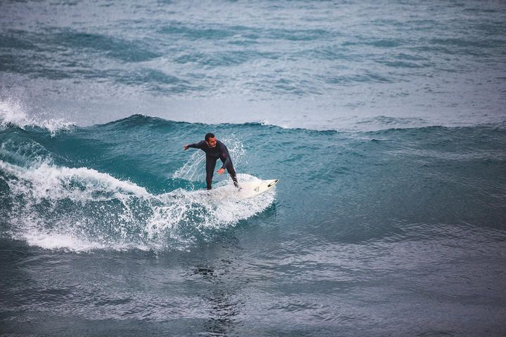 Surfer turning on a wave