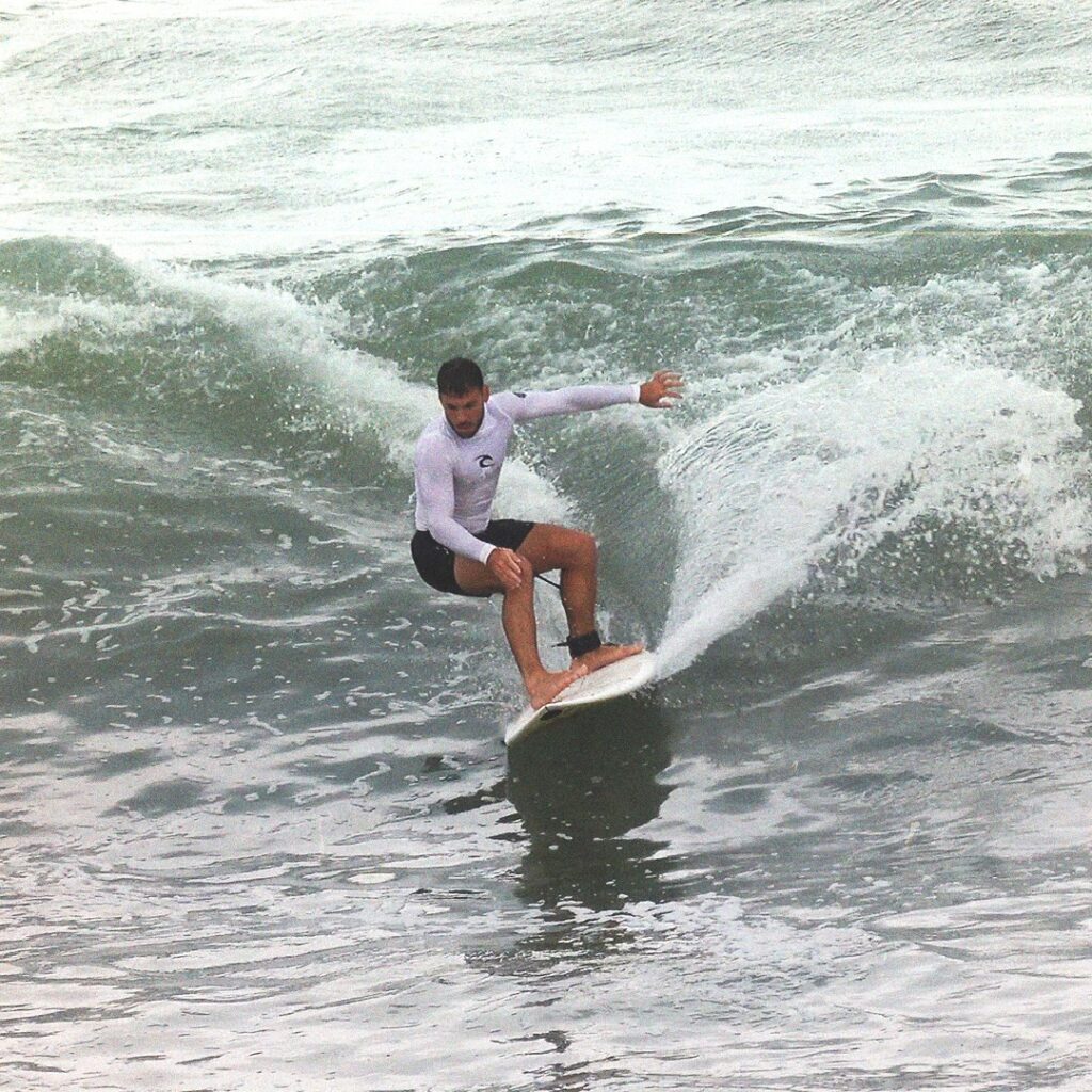 Surfer rides a wave