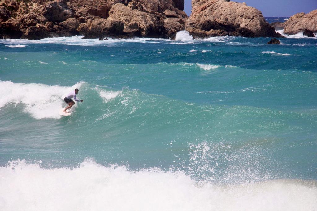 Surfer surfing in Malta