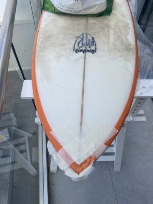 A surfboard in repair stage