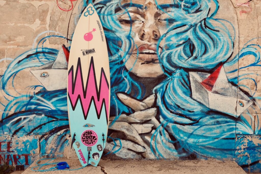 A surfboard showing a piece of art
