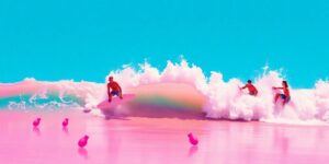 Surfers riding waves against a vibrant coastal backdrop.