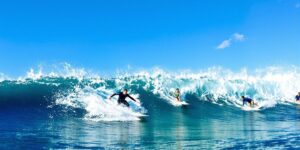 Surfers riding waves in a wave pool in Abu Dhabi.