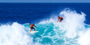 Tyler Wright and Barron Mamiya surfing at Pipe Pro.