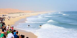 Surfers riding waves at Abu Dhabi during a competition.