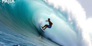 John John Florence surfing a large wave with intensity.