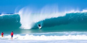 Surfer riding a wave at Surf City, El Salvador.