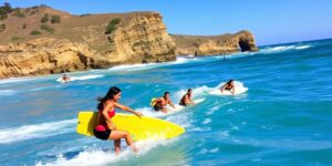Female surfers competing at Margaret River Pro surfing event.