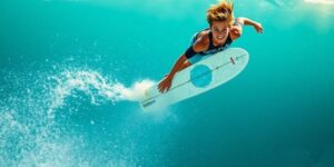 Teen Hughie Vaughan launching high in the air on a surfboard.