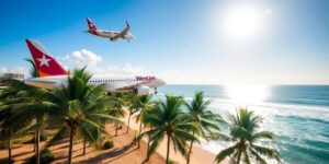 WestJet airplane flying towards a sunny Mexican beach.