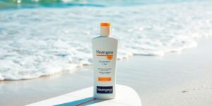 Neutrogena sunscreen bottle on a surfboard at the beach.