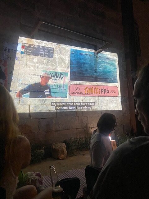 WSL World Surf league projected on a screen under the stars