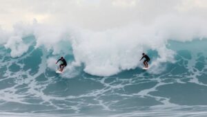 Surfers Luke Johnson and Ben Gravy riding huge hurricane waves.