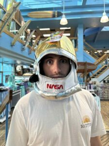 Surfer wearing Nasa space suit