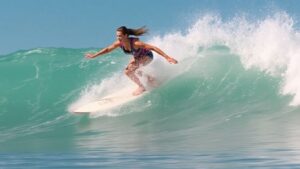 Surfer Ella McCaffray rides a wave during a competition.