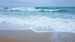 Dangerous ocean waves and rip currents at the coast.
