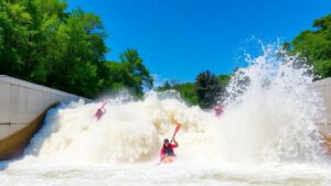 Kayakers ride a wave at a new whitewater surf park.
