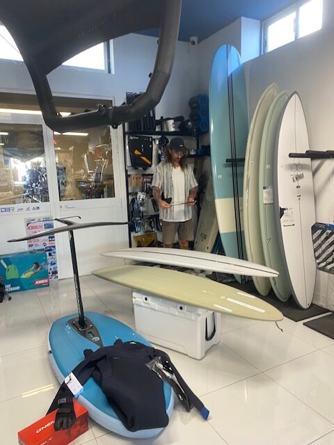 Surfer looking at new surfboards in Malta