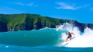 Surfer riding a wave in Manokwari, West Papua.