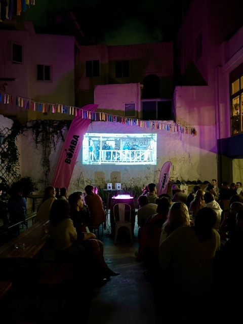 Surfers watching movie night