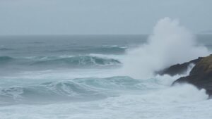 Dangerous ocean waves crashing on a US coastline.