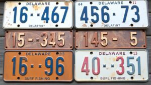 Low-digit Delaware surf fishing license plates for auction.