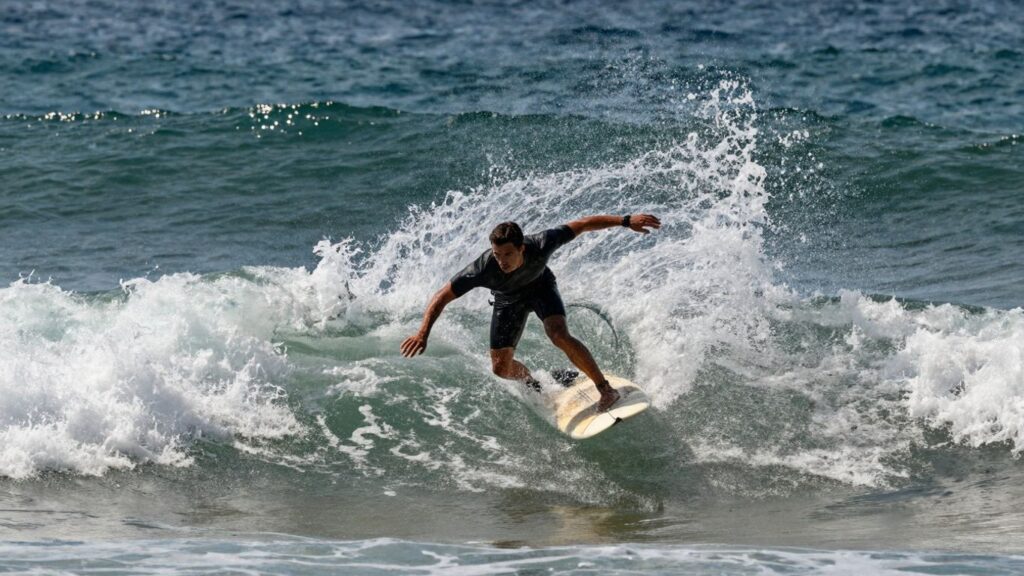 Surfer riding a wave at Corona Cero Surf Open Cerritos.