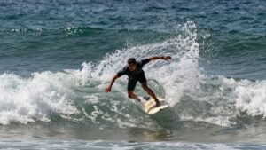 Surfer riding a wave at Corona Cero Surf Open Cerritos.